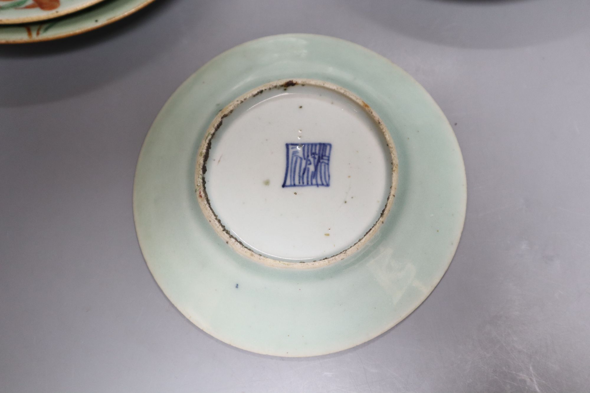 A set of five Chinese celadon famille rose plates, largest diameter 26cm